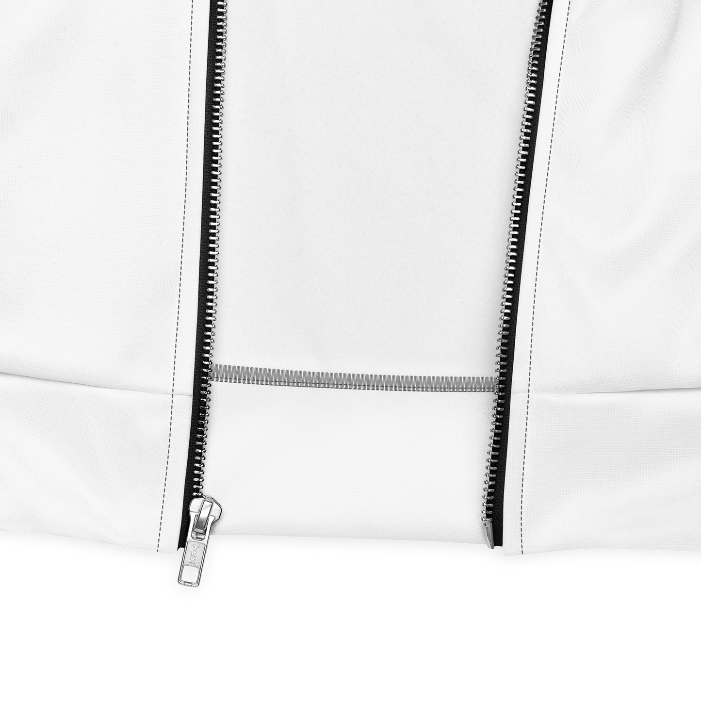 Close-up of white bomber jacket hem with contrasting black zipper and silver puller, crisp studio black backdrop.