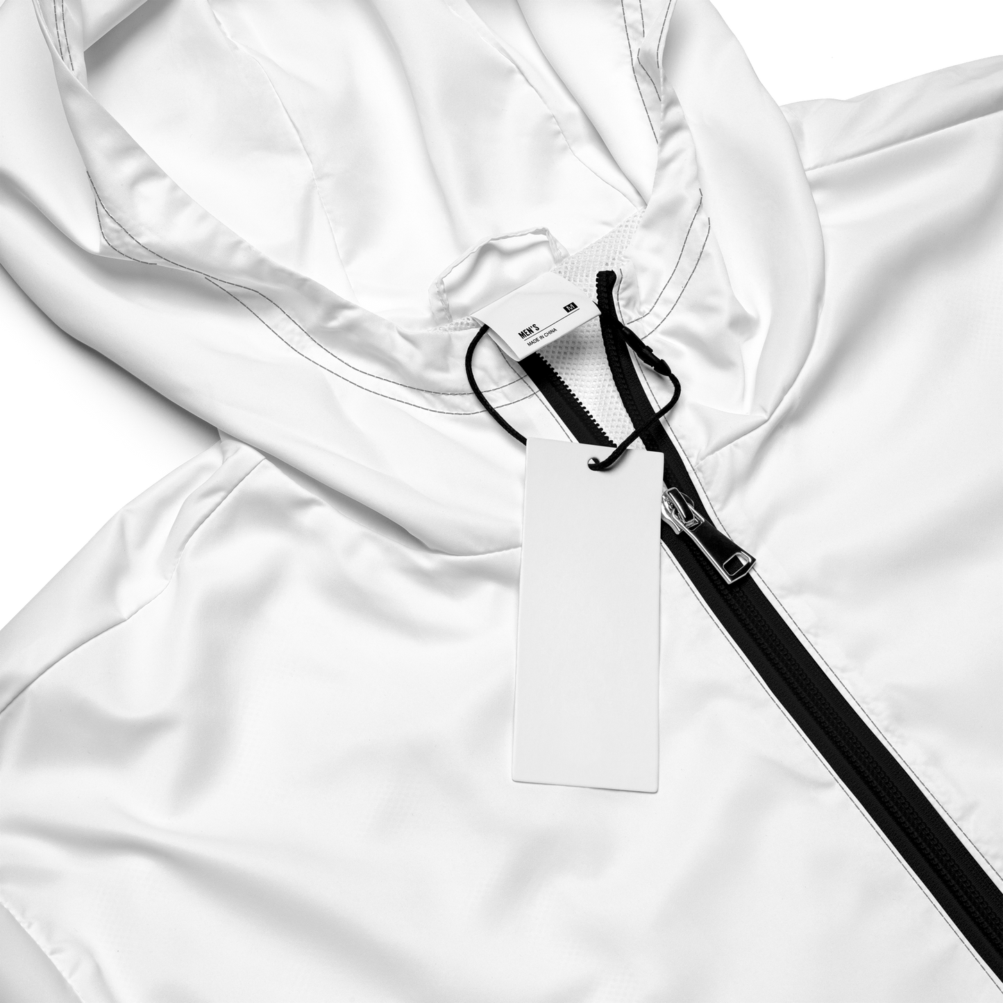 Close-up of white windbreaker hood with mesh lining, hang tag and contrasting black zipper, bright studio lighting.