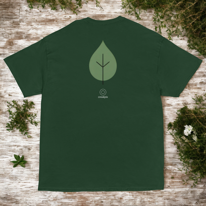 Back view of green unisex t-shirt with minimalist leaf emblem and small creatpix mark, nature flat-lay.