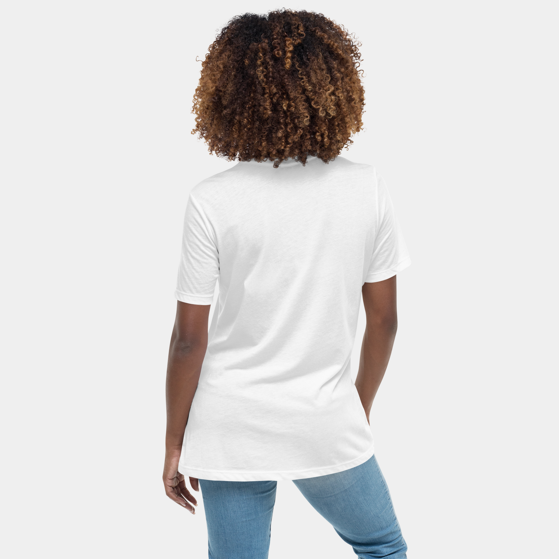 On-model back view of white tee with clean back, casual pose in studio light.