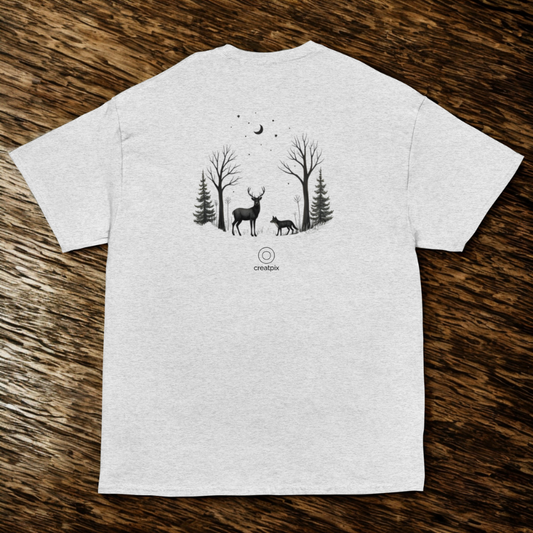 Back view of ash tee with deer and fox beneath a crescent moon in a pine grove, rustic wood background.
