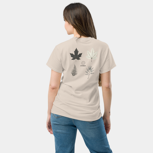 Back view of light beige Creatpix t-shirt with four botanical leaf and fern illustrations.