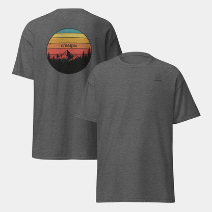 Charcoal Creatpix tee showing minimal front and retro mountain badge on the back.
