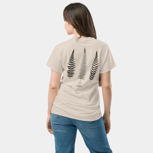 Back view of light beige Creatpix t-shirt with three vertical fern illustrations.