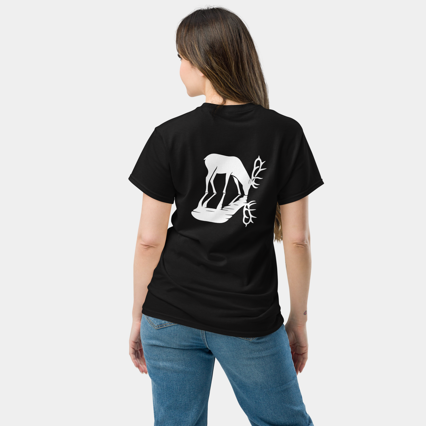back view of woman wearing a black organic cotton creatpix t-shirt with white deer and reflection design – now 15% off